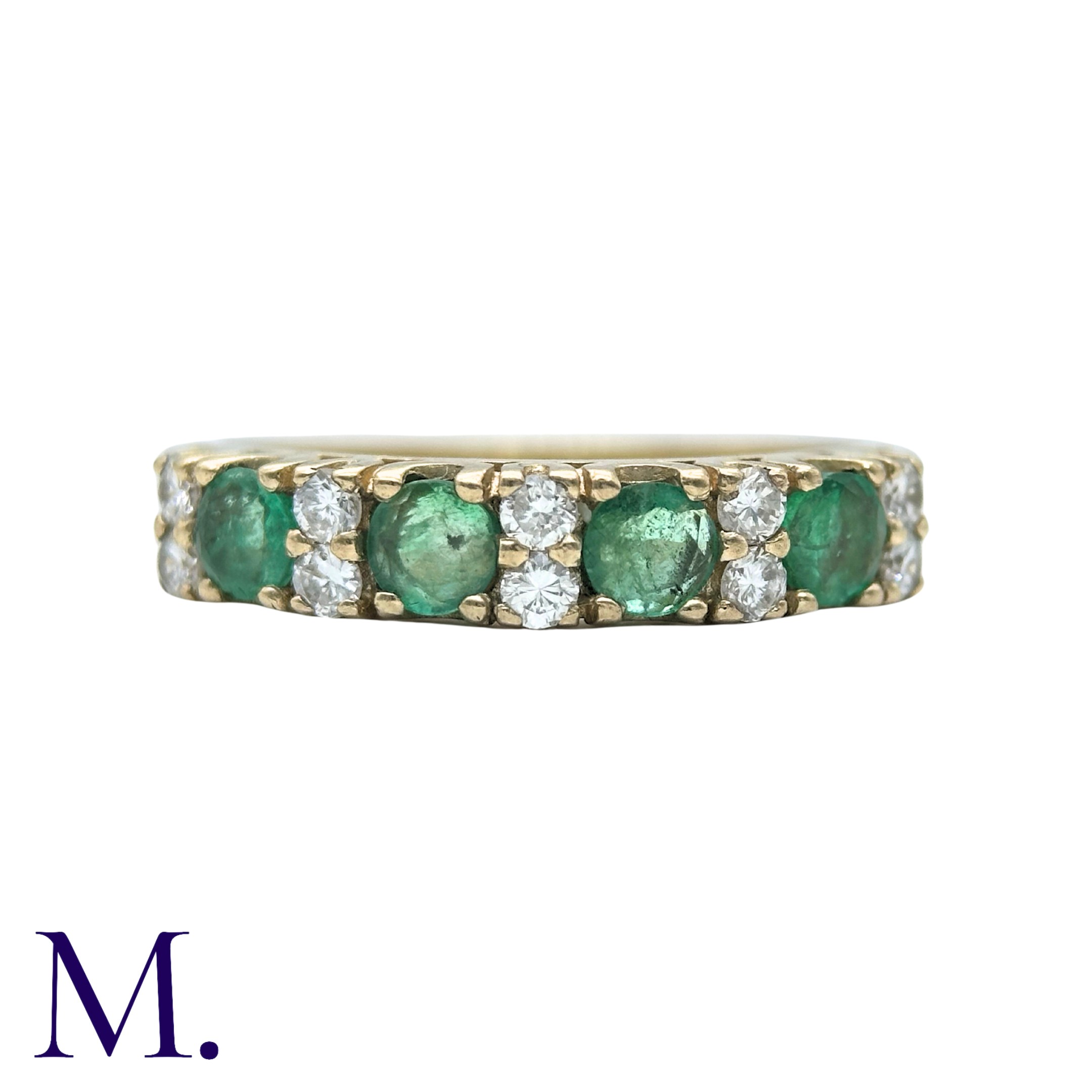 An Emerald And Diamond Ring in 9k yellow gold, set with four round cut emeralds punctuated with