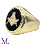 A Masonic Ring in yellow gold, set with an oval shaped onyx plaque set with a compass and square