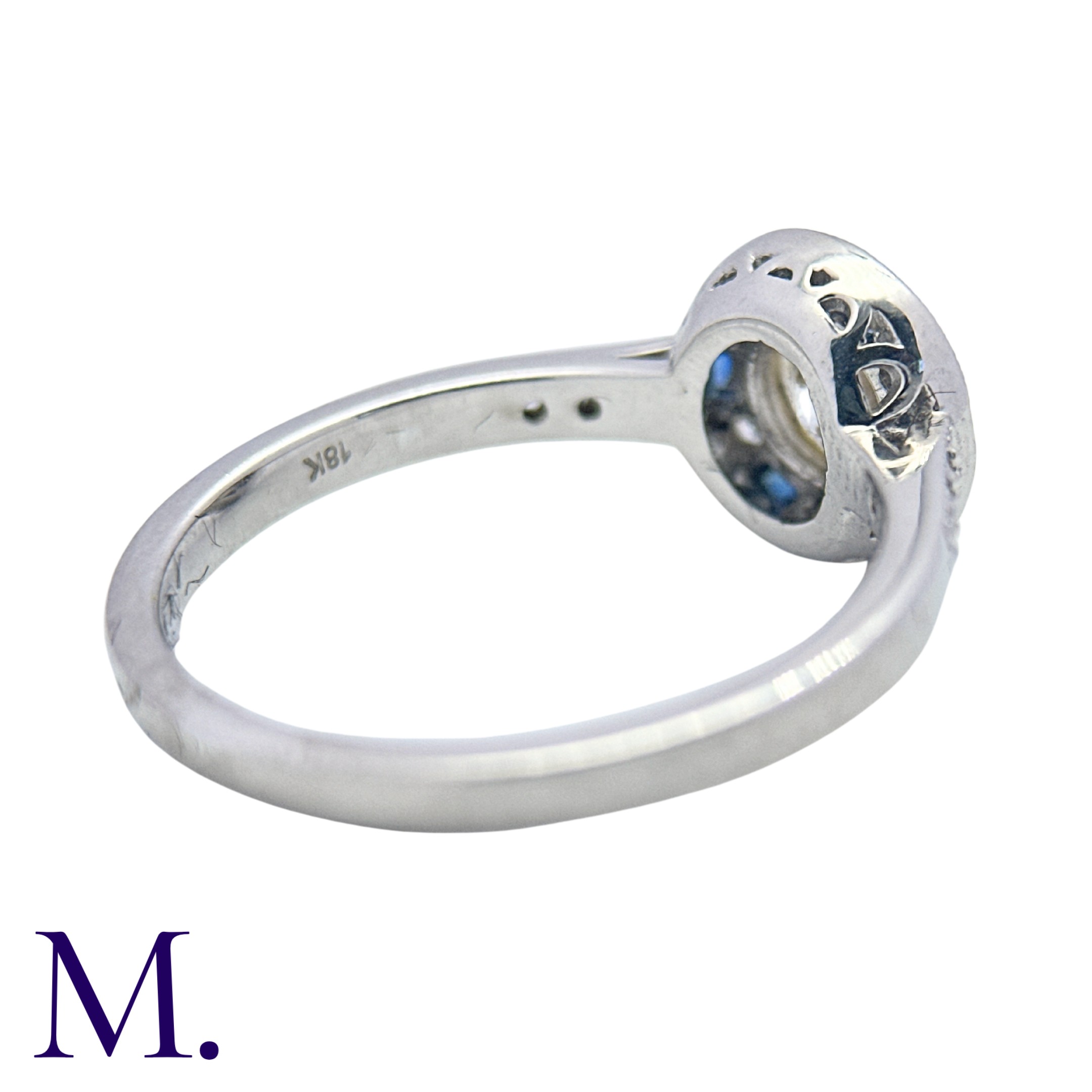 A Diamond And Sapphire Target Cluster Ring in 18k white gold, set with a principal round cut diamond - Image 4 of 4