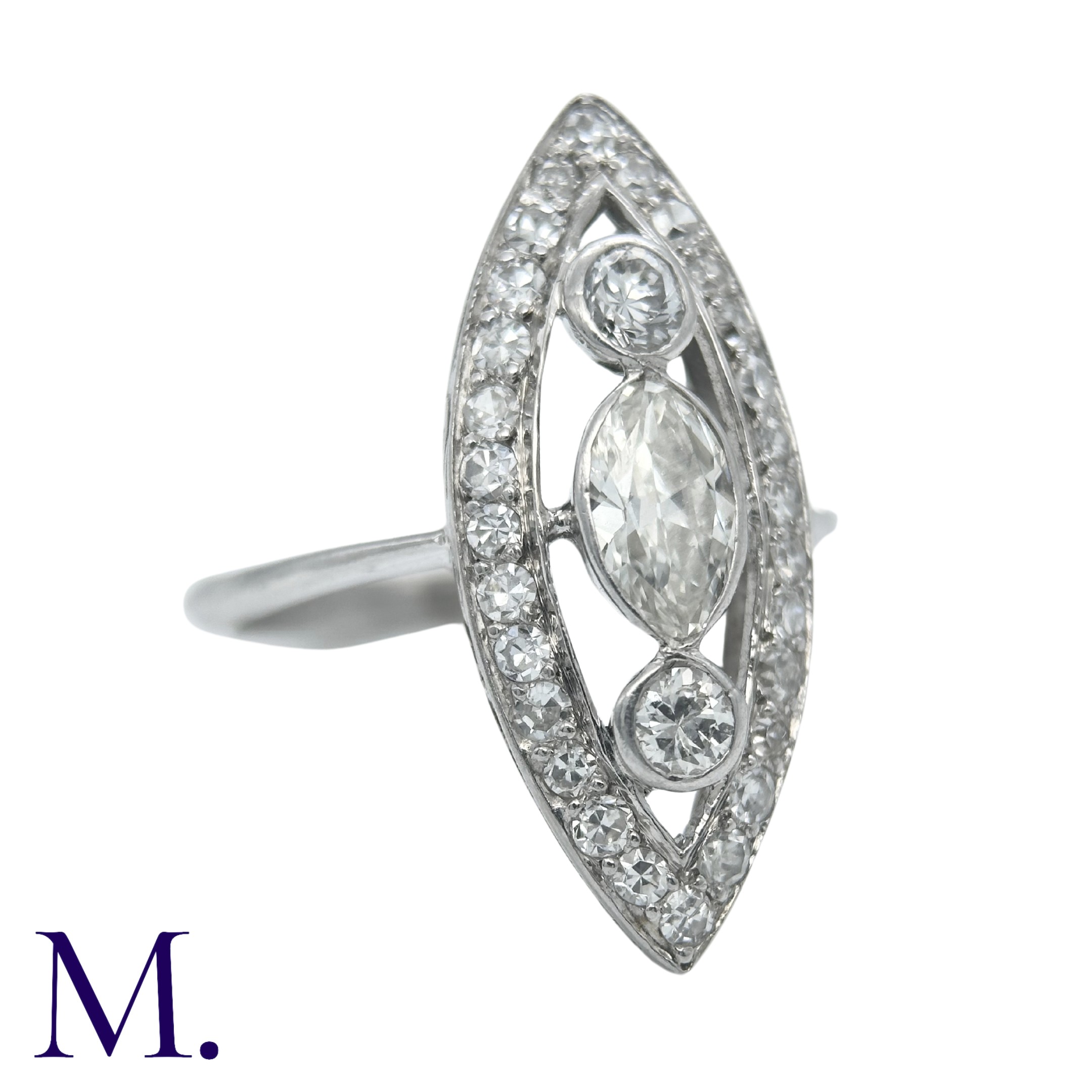 An Art Deco Diamond Ring in an openwork marquise shape with two principal round cut diamonds of