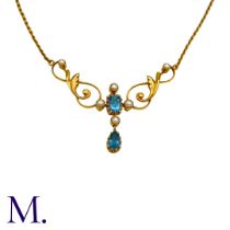 An Aquamarine And Pearl Necklace in 15k yellow gold, set with a step cut aquamarine and pearls