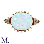 A Synthetic Opal And Diamond Ring in 9k yellow gold, set wit a cabochon synthetic opal, with diamond