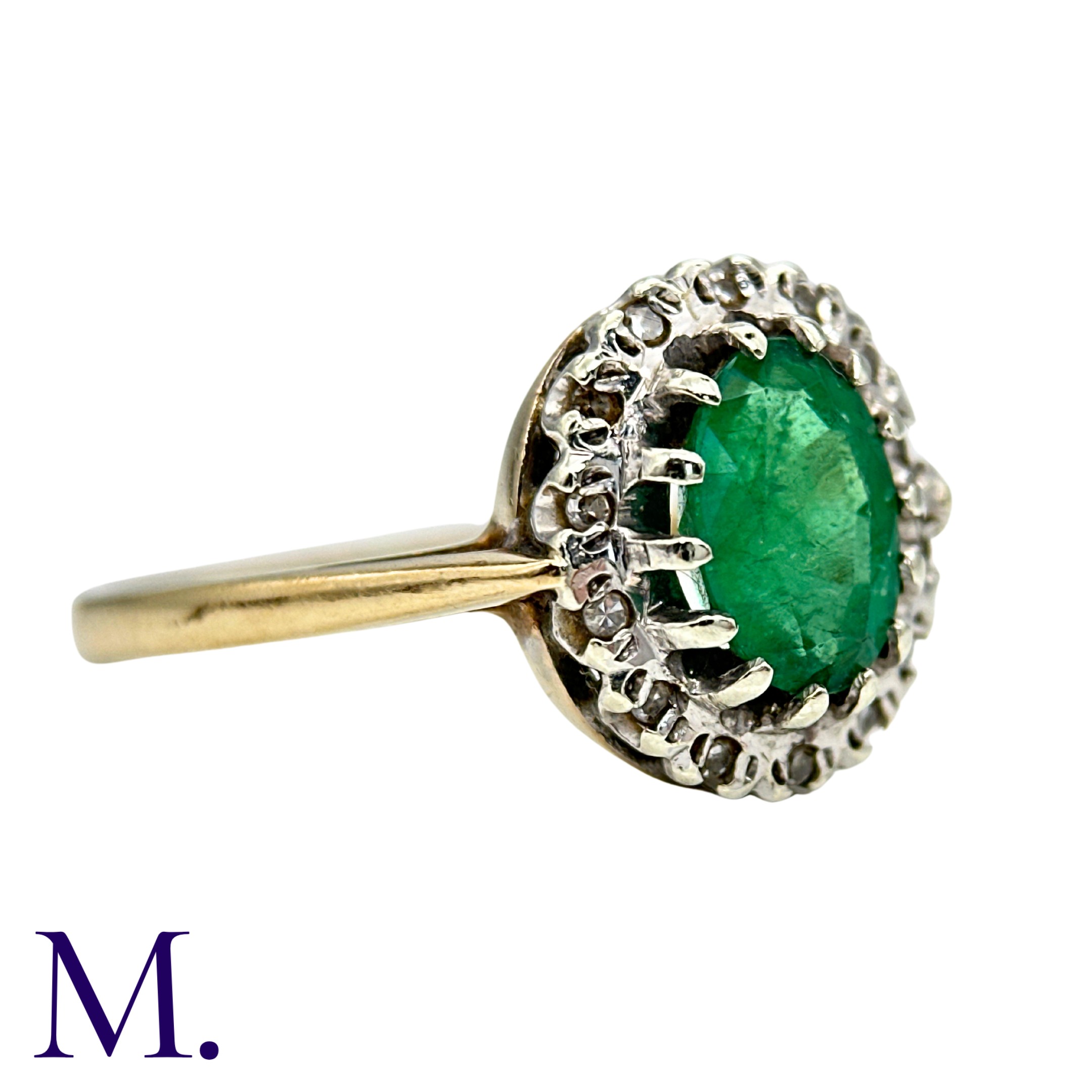 An Emerald And Diamond Cluster Ring in yellow and white gold, set with a principal oval cut - Image 3 of 4