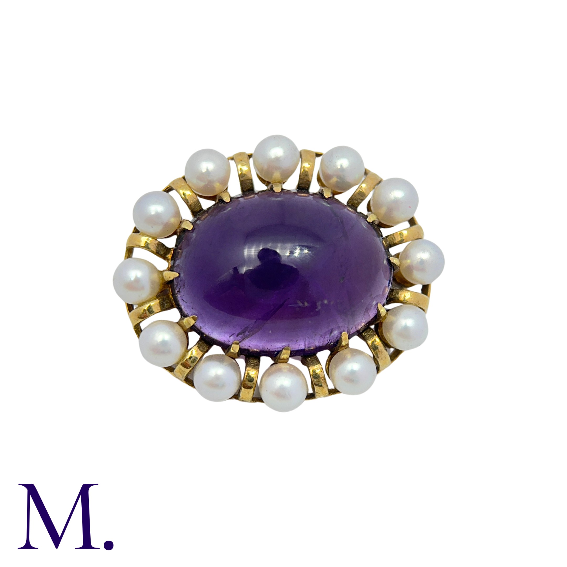 An Amethyst And Pearl Brooch in 14k yellow gold, set with a large cabochon amethyst within a