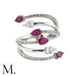 A Ruby and Diamond Ring in 18K white gold set with pear-shaped rubies and diamonds, with