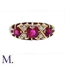 A Red Spinel and Diamond Ring in 18K yellow gold set with three large red spinels and four small