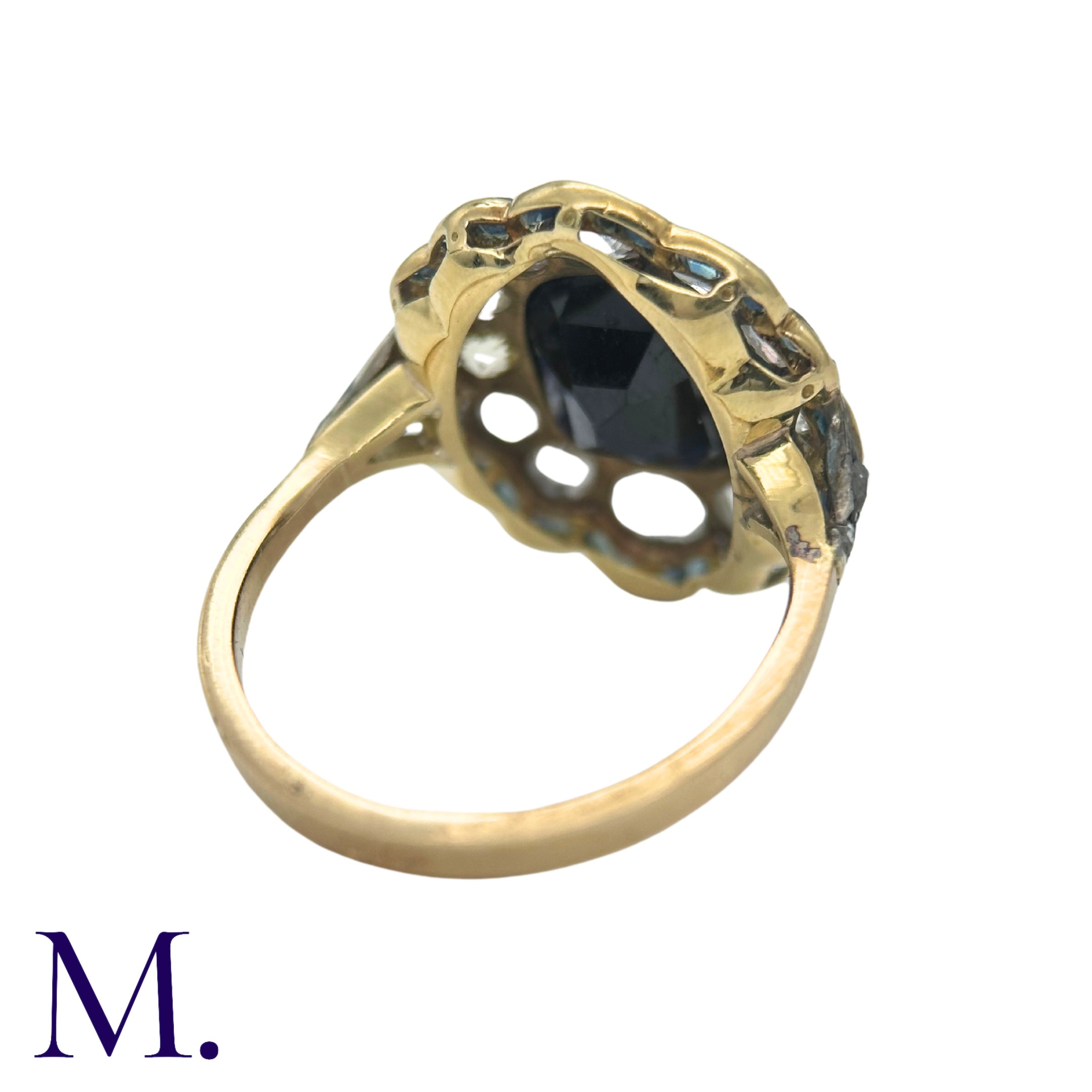 A Sapphire and Diamond Cluster Ring in 18K yellow gold with a large oval-cut sapphire of - Image 5 of 6