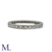 A Diamond Full Eternity Ring in platinum, set all around with a row of round cut diamonds.