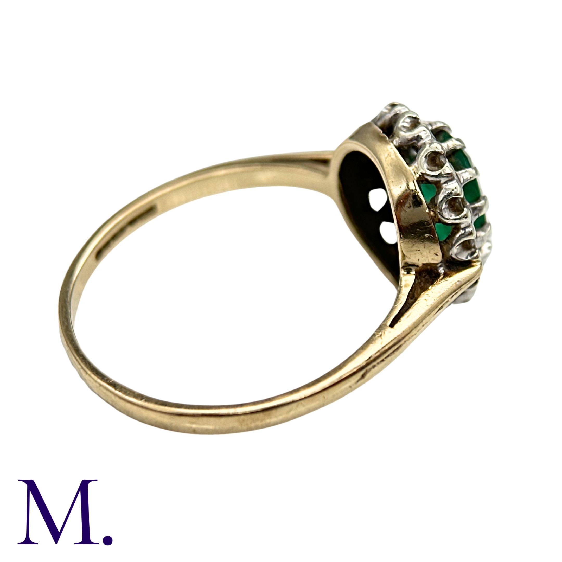 An Emerald And Diamond Cluster Ring in yellow and white gold, set with a principal oval cut - Image 4 of 4