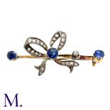 An Antique Sapphire And Diamond Bow Brooch in yellow gold and silver, comprising a diamond set bow