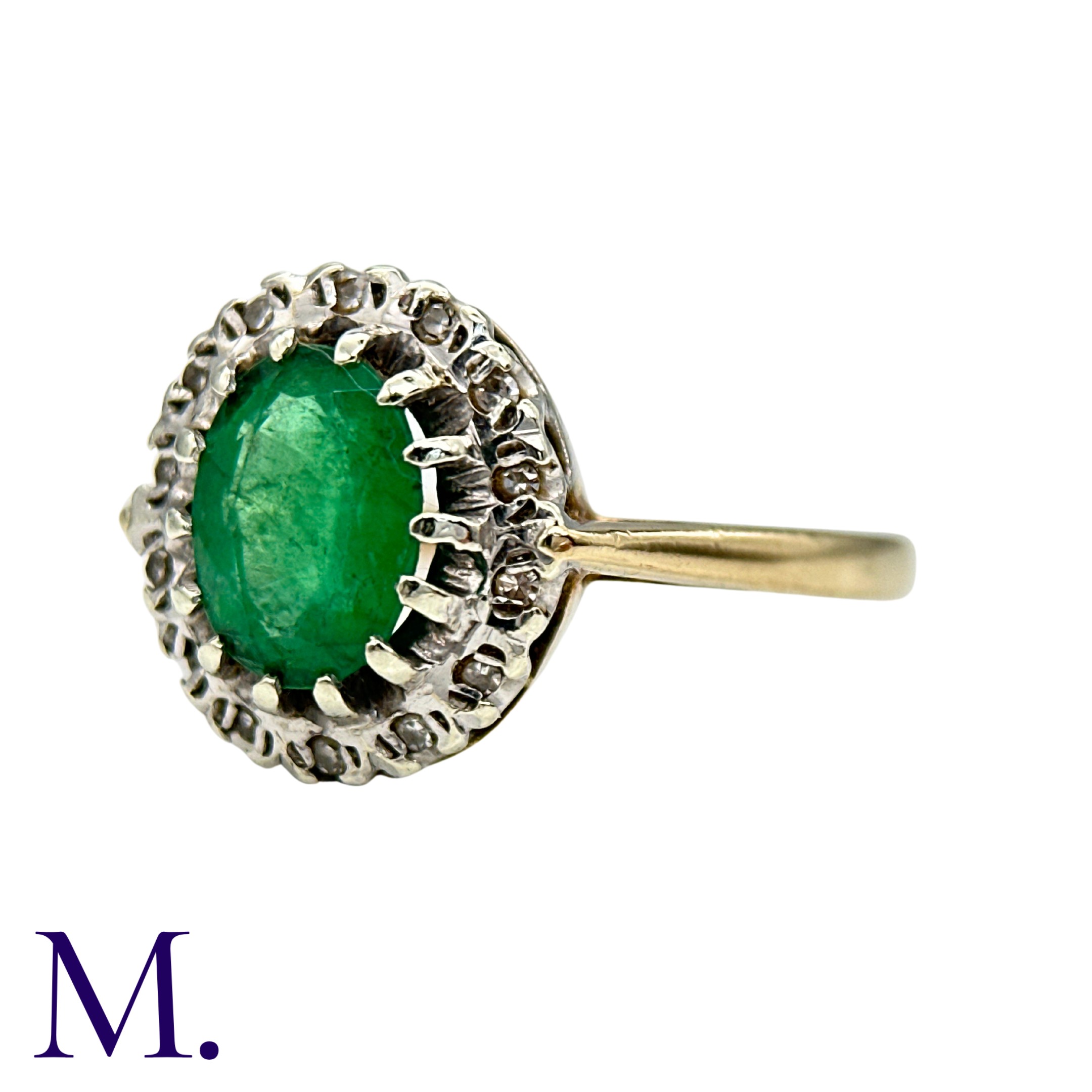 An Emerald And Diamond Cluster Ring in yellow and white gold, set with a principal oval cut - Image 2 of 4