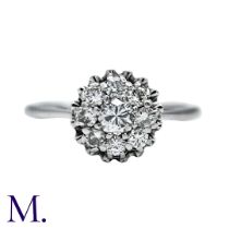 A Diamond Cluster Ring in 18K white gold, set with nine diamonds totalling approximately 0.55ct in
