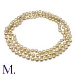 A Pearl Sautoir Necklace comprising a long string of pearls measuring approximately 8.5mm. Size: