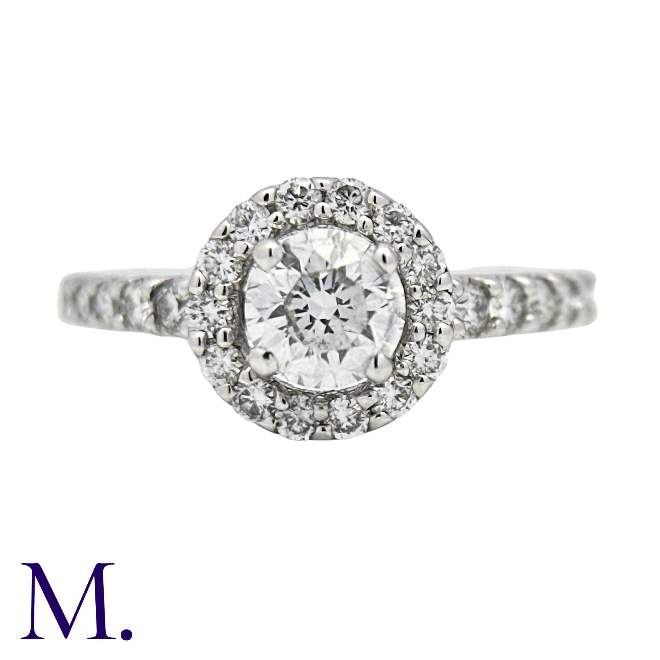 A Diamond Solitaire Ring in 18k white gold, set with a principal round cut diamond of