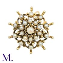 A Pearl Brooch in yellow gold set with a pearls. Unmarked but tests indicate 14 carat gold. Size:3.