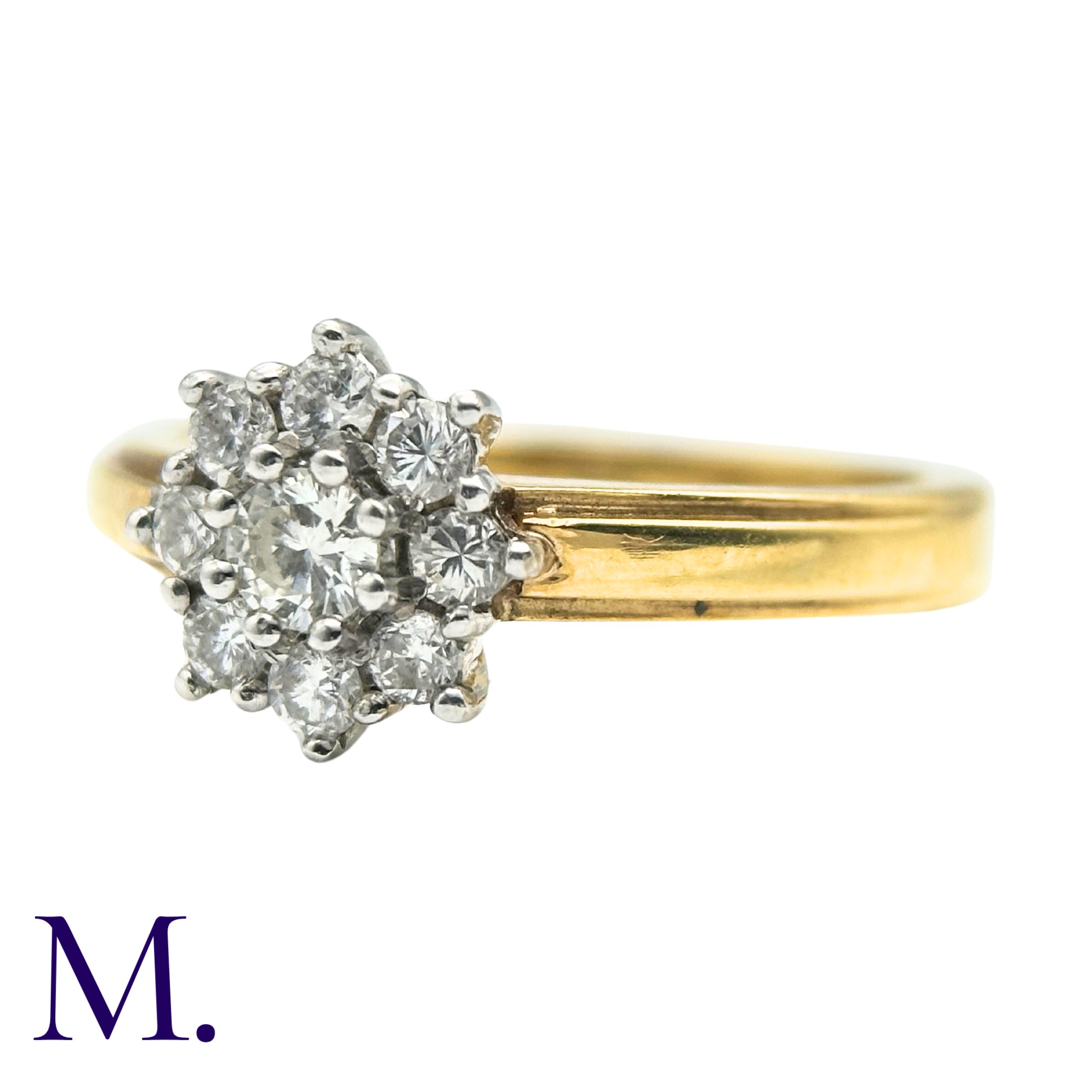 A Diamond Cluster Ring in 18k yellow gold, set with a cluster of round cut diamonds. Hallmarked