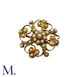A Pearl Brooch in 15k yellow gold, the openwork scrolling and foliate form set with pearls.
