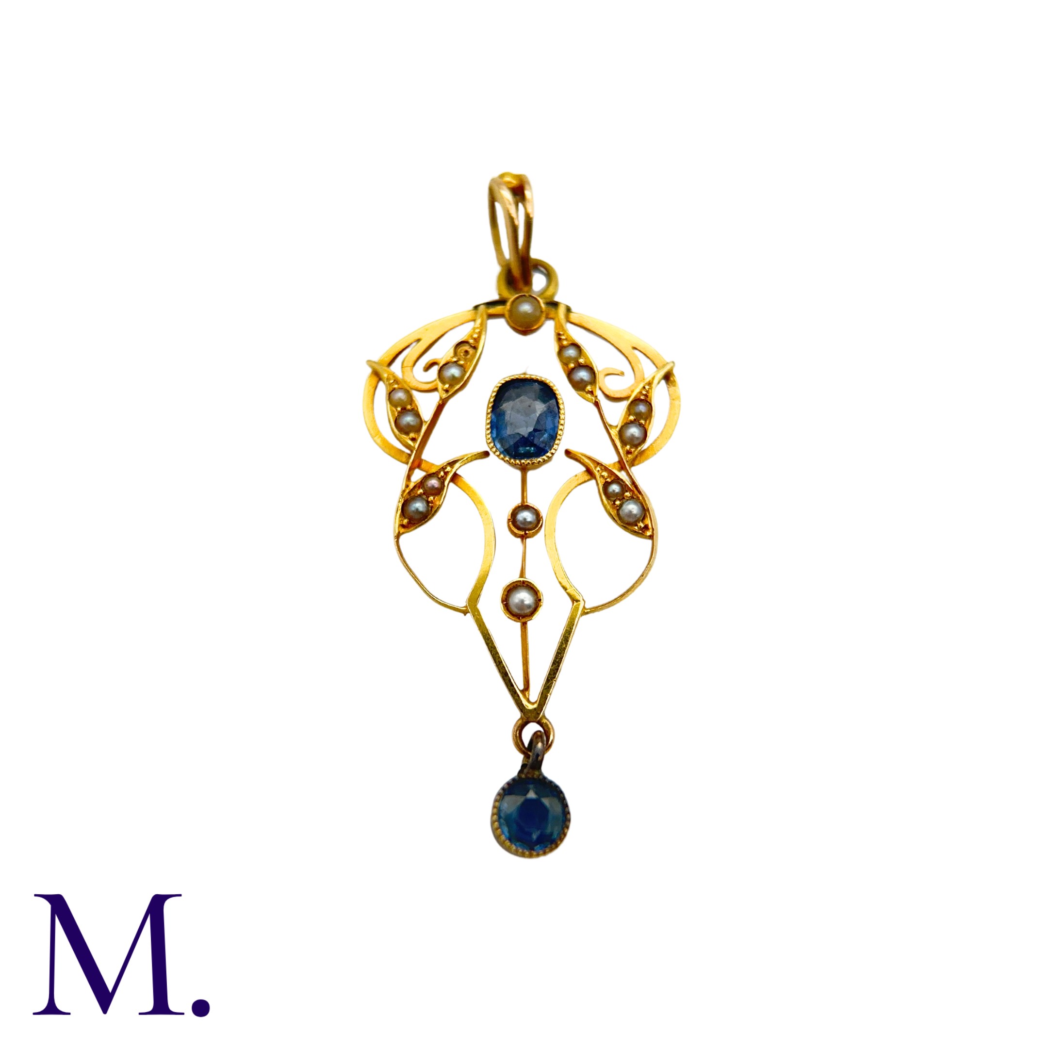 A Sapphire And Pearl Pendant in 15k yellow gold, the open work foliate and scrolling form set with a