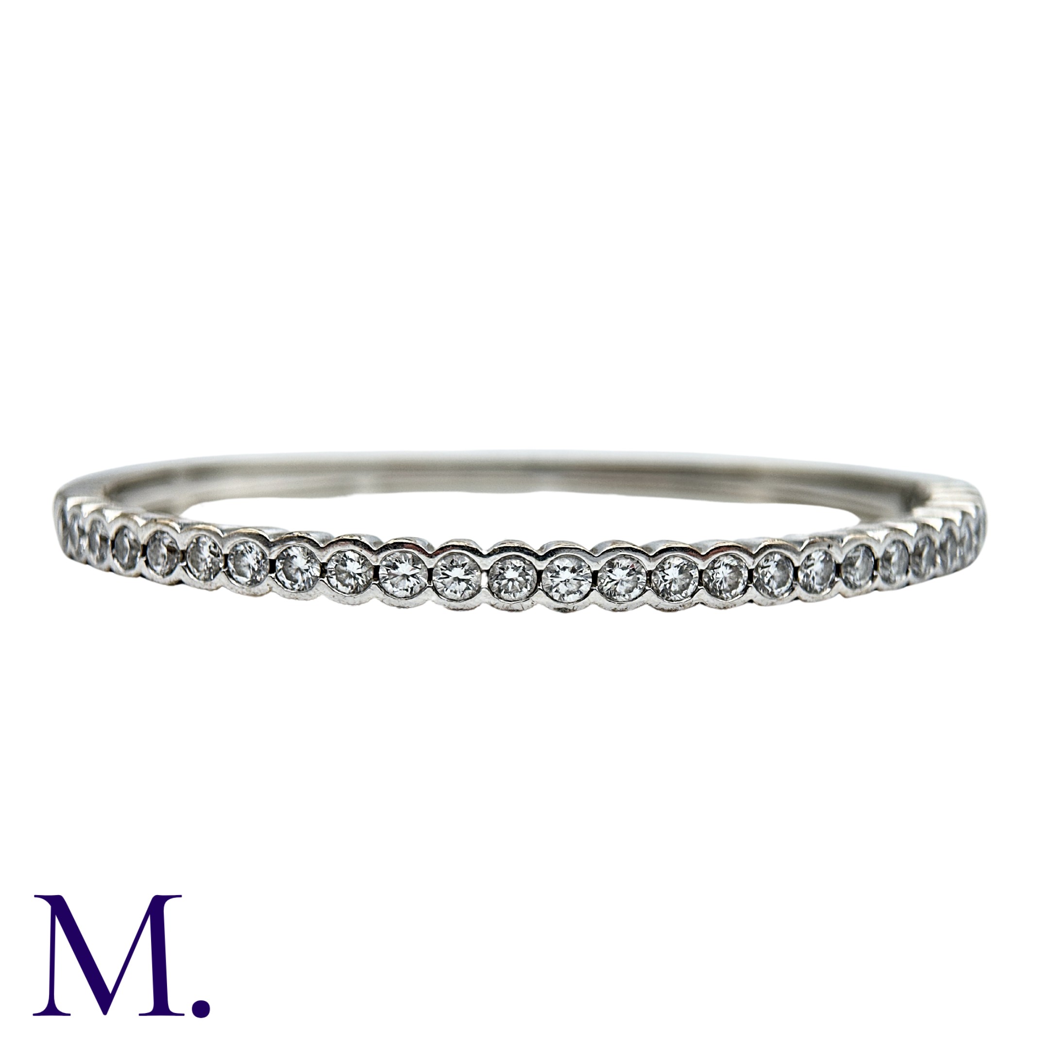 A Diamond Bangle in 18k white gold, comprising a row of round brilliant cut diamonds totalling