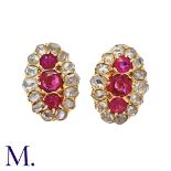 A Pair Of Ruby And Diamond Cluster Earrings in yellow gold, each comprising a trio of round cut