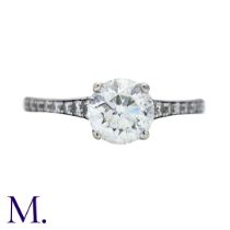 A Diamond Solitaire Ring in 18k white gold set with a principal round cut diamond of approximately