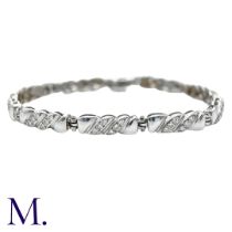 A Diamond Bracelet in 18k white gold, comprising nine twisted form links set with round cut