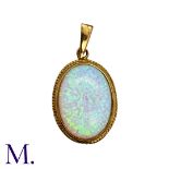 A Synthetic Opal Pendant in 9k yellow gold set with a large cabochon synthetic opal within a gold