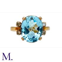 A Spinel and Diamond Ring in 18K yellow gold, set with an oval blue spinel of approximately 1.2x1.