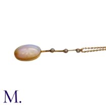 An Opal And Pearl Pendant Necklace in yellow gold, comprising a large cabochon opal below a trio