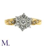 A Diamond Cluster Ring in 18k yellow gold, set with a cluster of round cut diamonds with further