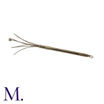 A Gold Cocktail Stirrer in 9K yellow gold with push to open-pull to close function. Hallmarked for