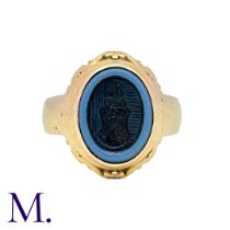 An Agate Signet Ring in yellow gold, set with a carved intaglio banded agate. Size: J1/2 Weight: 7.