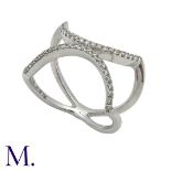 A Diamond Ring in 18K white gold set in a fine stylised 'X' form with diamonds weighing