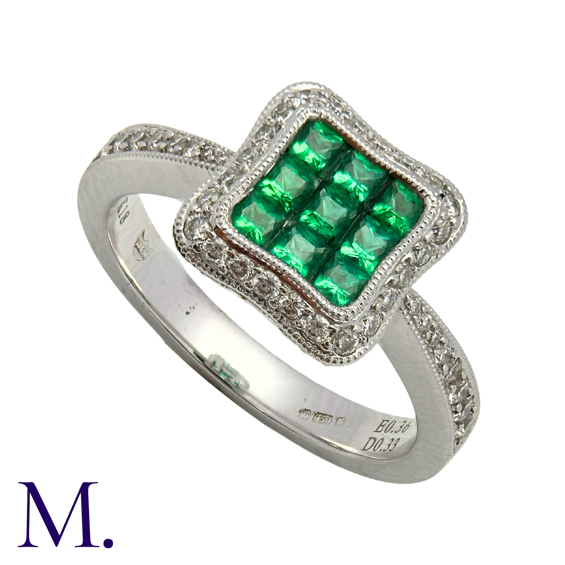 An Emerald and Diamond Ring in 18K white gold, set with nine square cut emeralds in a square panel