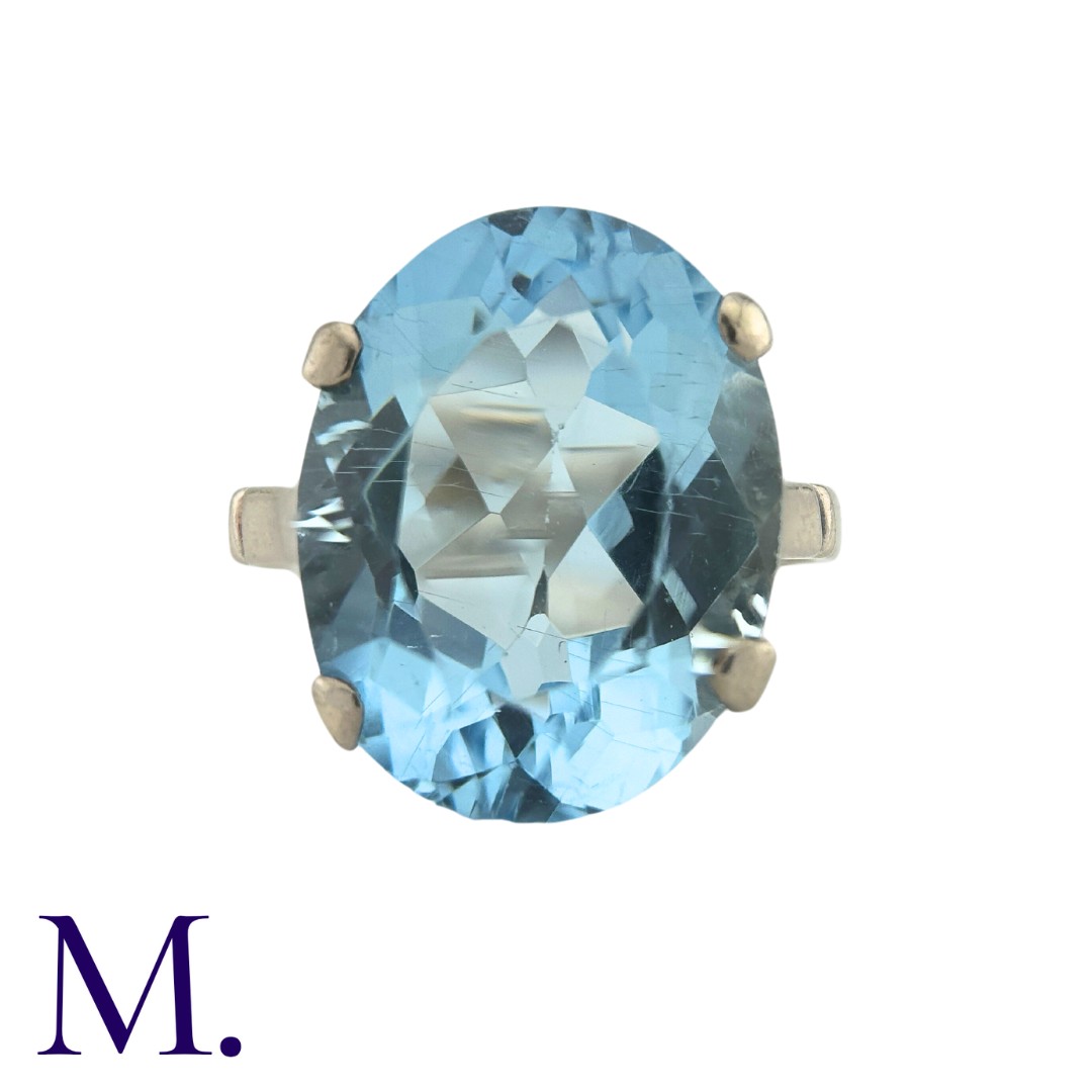 A Topaz Ring in white gold, set with a blue topaz weighing approximately 10.8ct Size: L1/2 Weight: