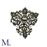An Antique Rose Diamond Brooch in silver of foliate and bow motif, set with rose cut diamonds.