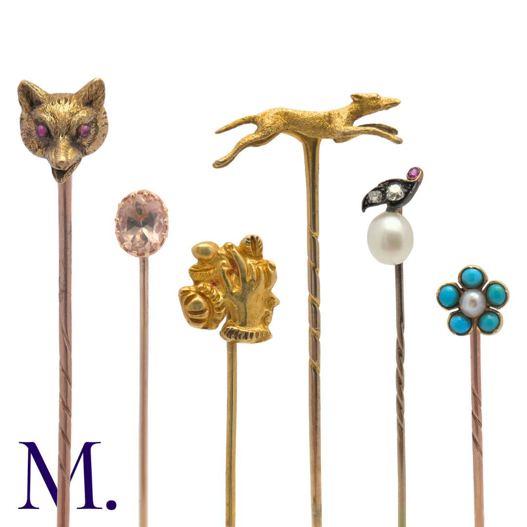 A Collection of Antique Stick Pins in yellow gold including one set with golden topaz (7.4cm), one