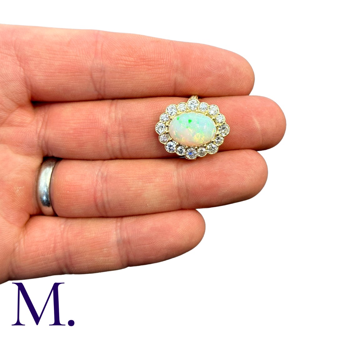 An Opal And Diamond Cluster Ring in 18k yellow gold, set with a principal cabochon opal of - Image 5 of 5