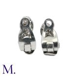 A Pair of Diamond Earclips in white gold scrolling form, set with diamonds weighing approximately