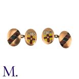 A Pair of Cufflinks in 9K rose gold with enamel crest and design. Hallmarked for 9ct gold. Size: 1.
