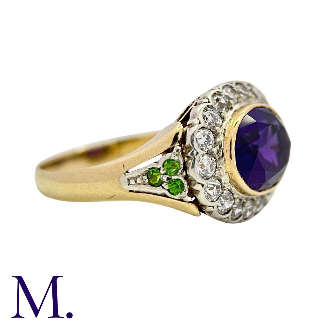 An Amethyst and Diamond Cluster Ring in yellow gold and silver, set with a principal oval cut - Image 2 of 3