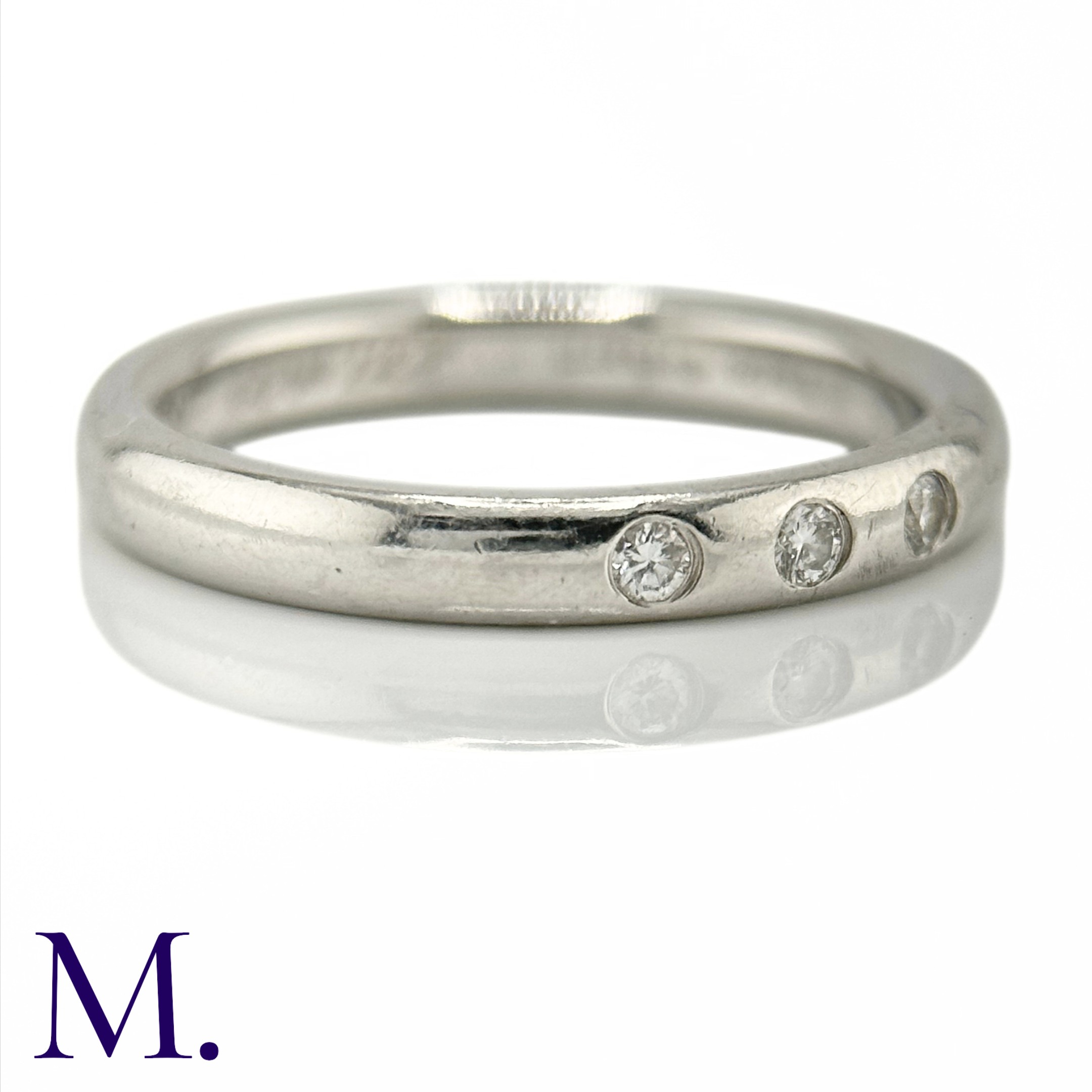 TIFFANY & CO. A Diamond Accent Ring in platinum, set with three round cut diamonds weighing - Image 2 of 4