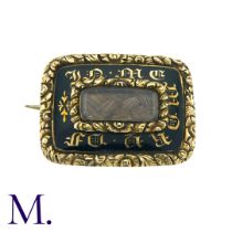 A Regency Hairwork Mourning Brooch in yellow gold. Black enamel work to the front with words 'in