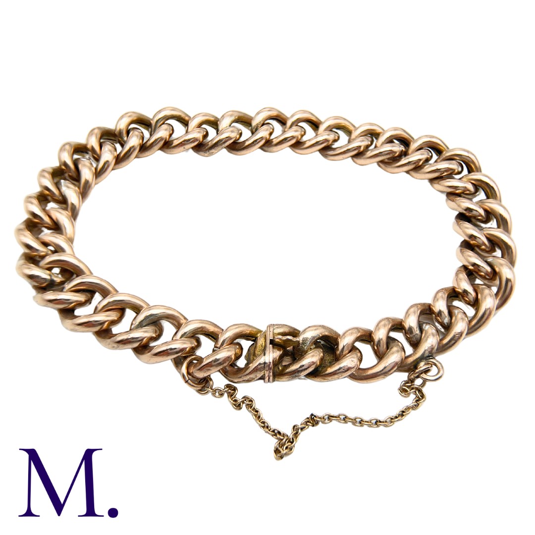 A Gold Curb Bracelet in 9K rose gold, with integrated fastening and safety chain. Size: 21cm Weight: - Image 2 of 3