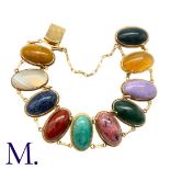 An Antique Hardstone Bracelet in yellow gold, set with oval cabochons of various agate and other