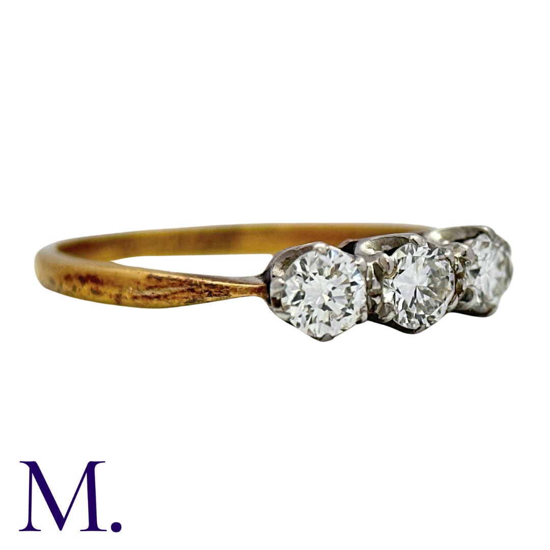 A 3-Stone Diamond Ring in yellow gold and platinum. Set with three round brilliant cut diamonds - Image 3 of 3