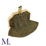 A Mesh Purse in 14K yellow gold with cabochon sapphire clasp. Frame marked for 14ct gold. Size: 5.