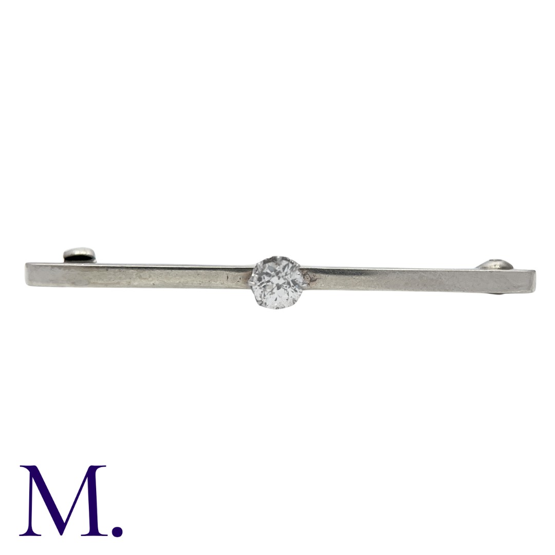 A Diamond Bar Brooch in 9K white gold, set with an old cut diamond weighing approximately 0.35ct