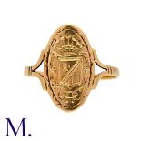 An Antique Gold Signet Ring in yellow gold. Armorial crest to oval face with split shoulder ring.
