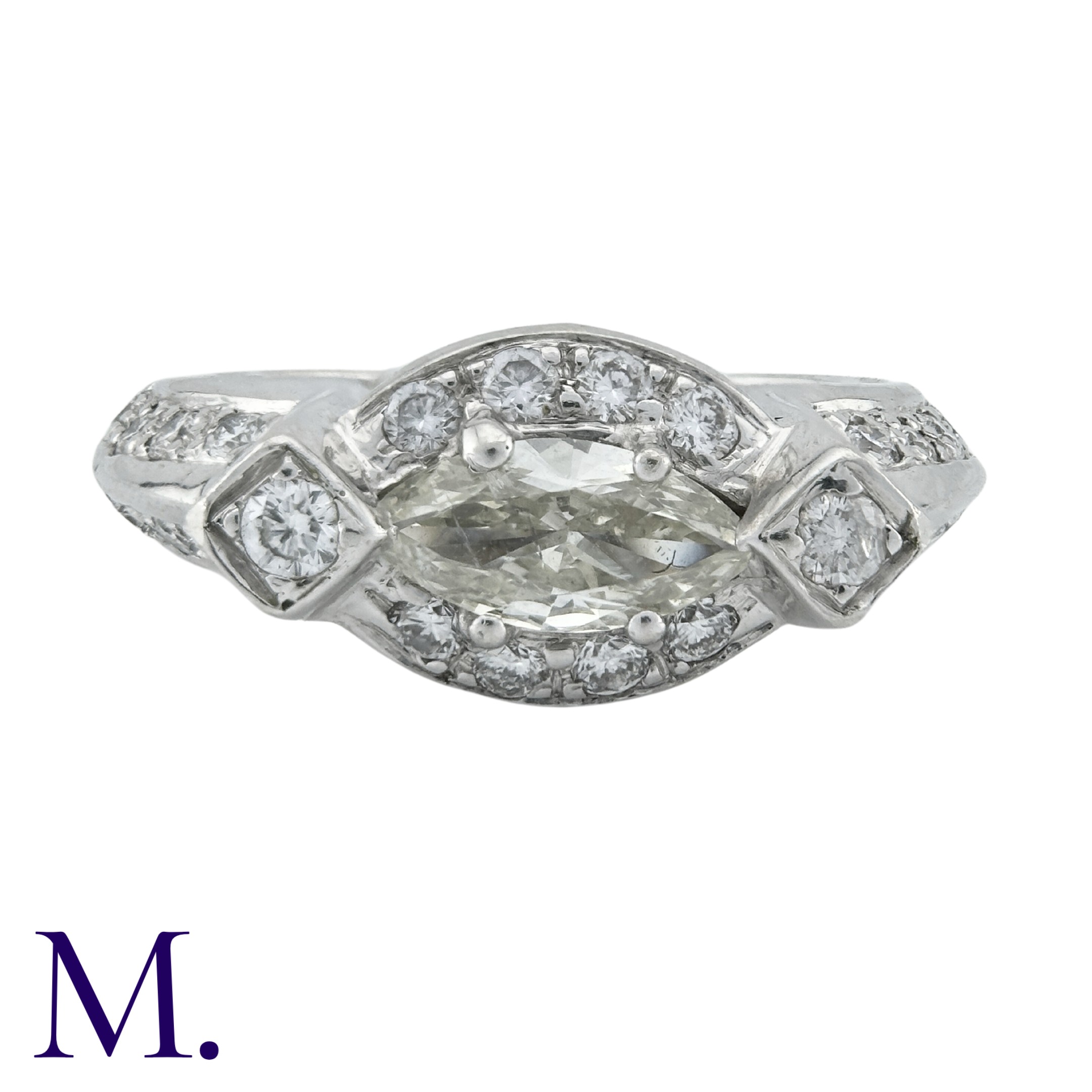 A Diamond Ring, in 18k white gold, set with a principal marquise cut stone of approximately 0.